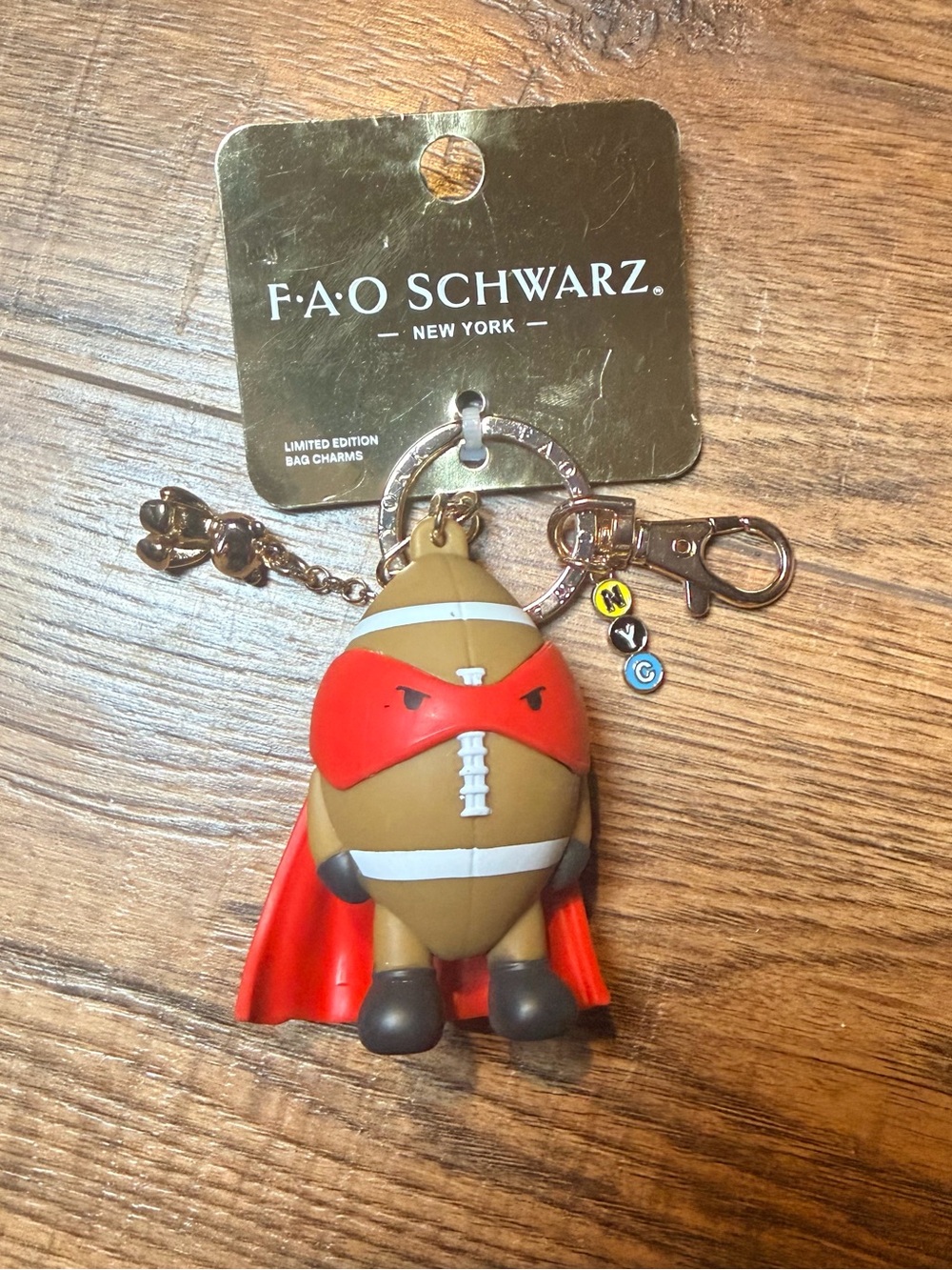 FAO Schwarz Red & Brown Superhero Football Bag Charm Keychain